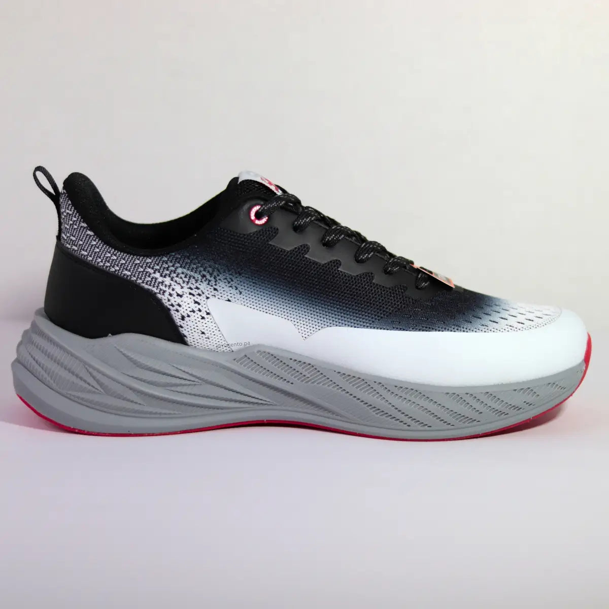 Vista lateral interna zapatillas deportivas hombre suela foam gris y malla transpirable