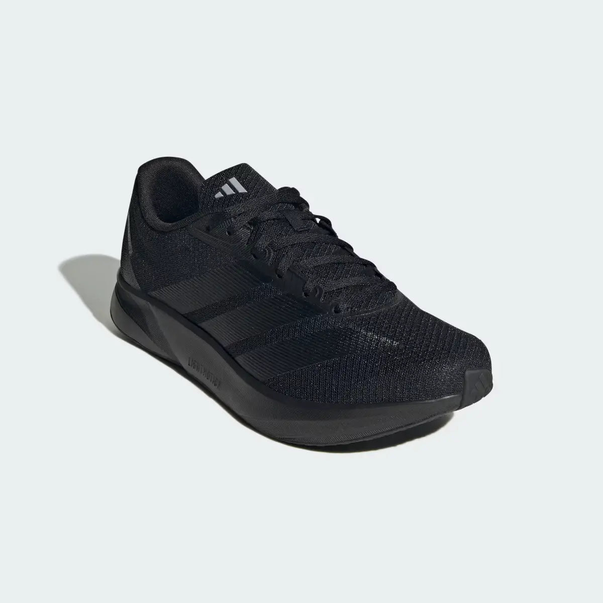 Zapatillas running hombre Adidas Duramo RC2 M negras vista en ángulo frontal de tres cuartos