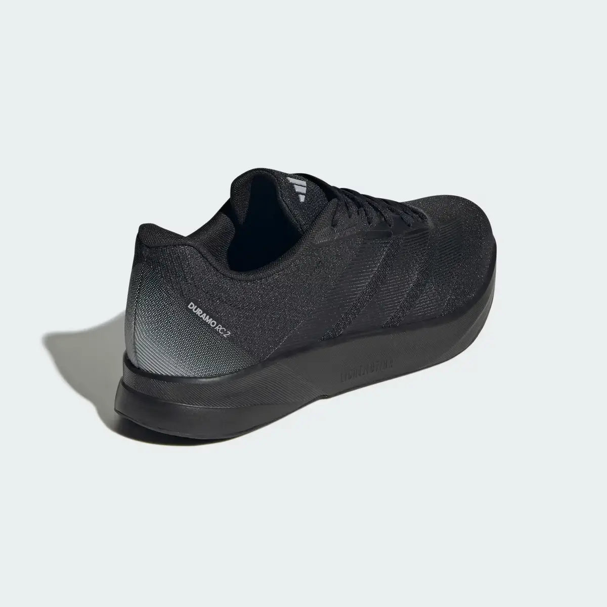 Vista trasera de talón de zapatillas hombre Adidas Duramo RC2 M negras mostrando soporte y estructura