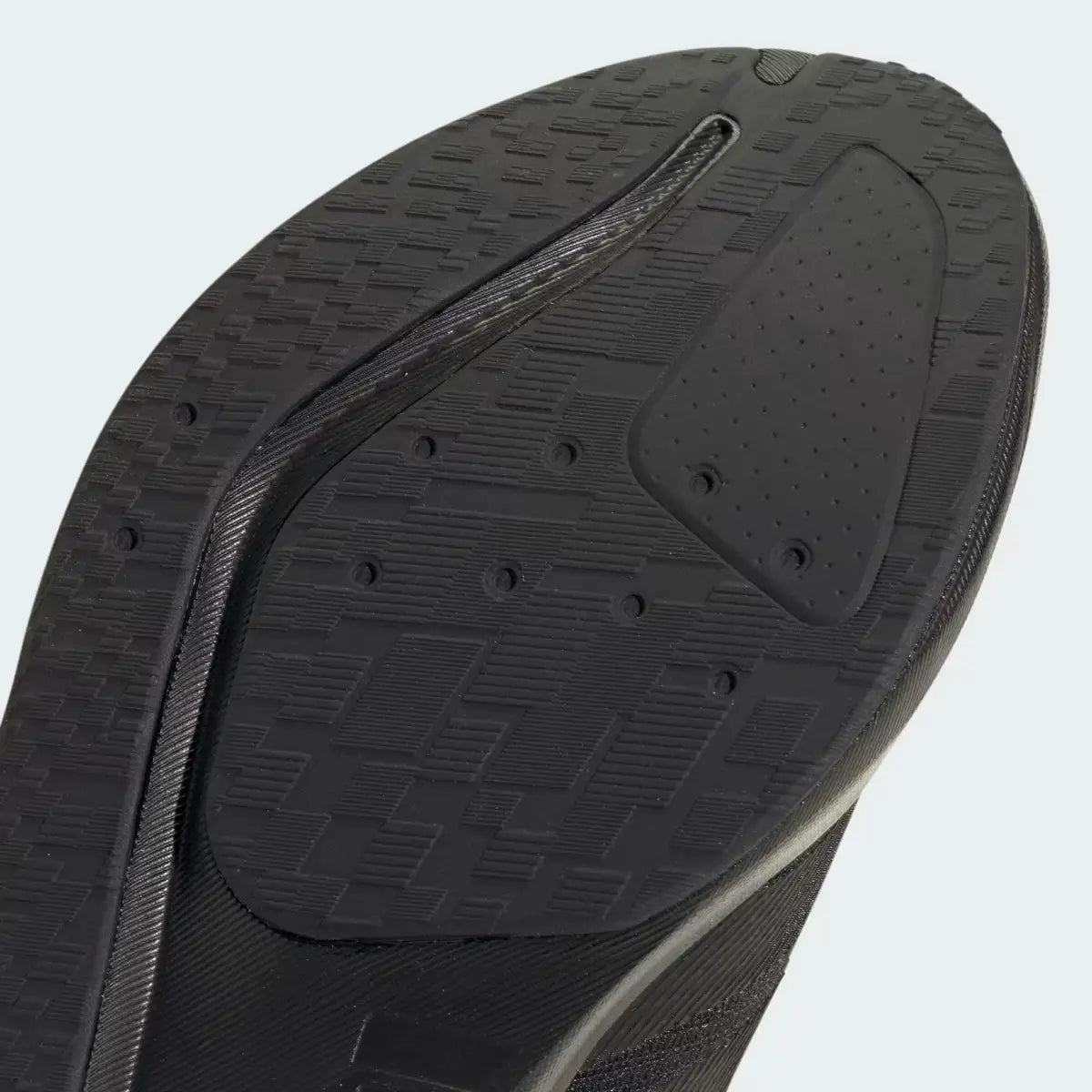 Primer plano de la suela exterior Adiwear y ranuras de flexión en zapatillas deportivas Adidas Duramo RC2 M