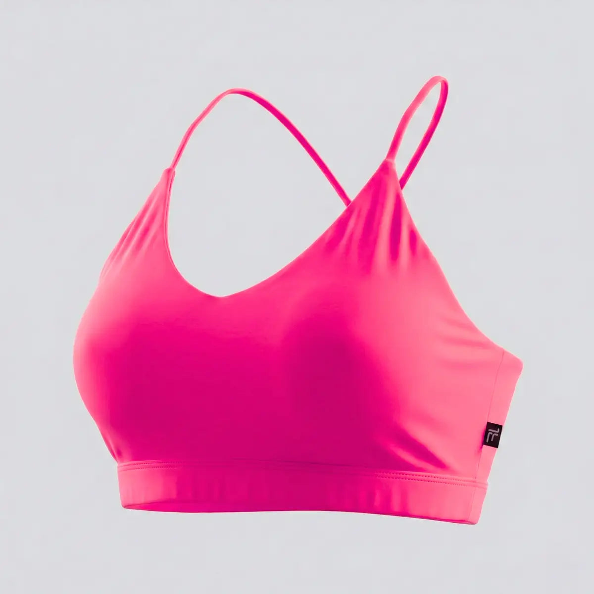 Top deportivo fucsia tiras finas spaghetti marca BYLOVE fondo blanco