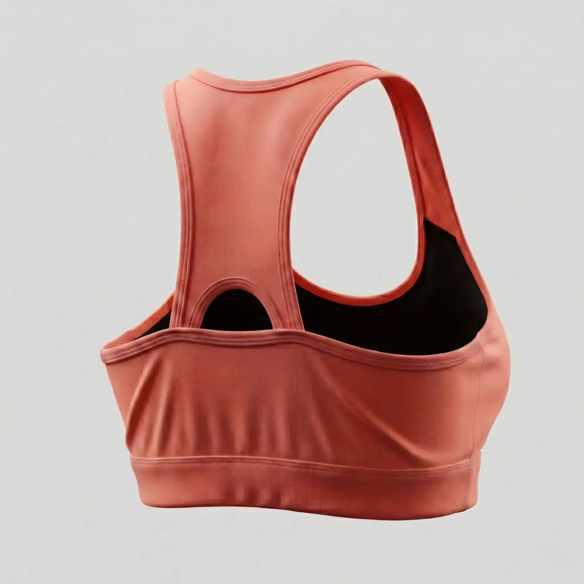 Top deportivo espalda nadadora con abertura para ventilación color coral