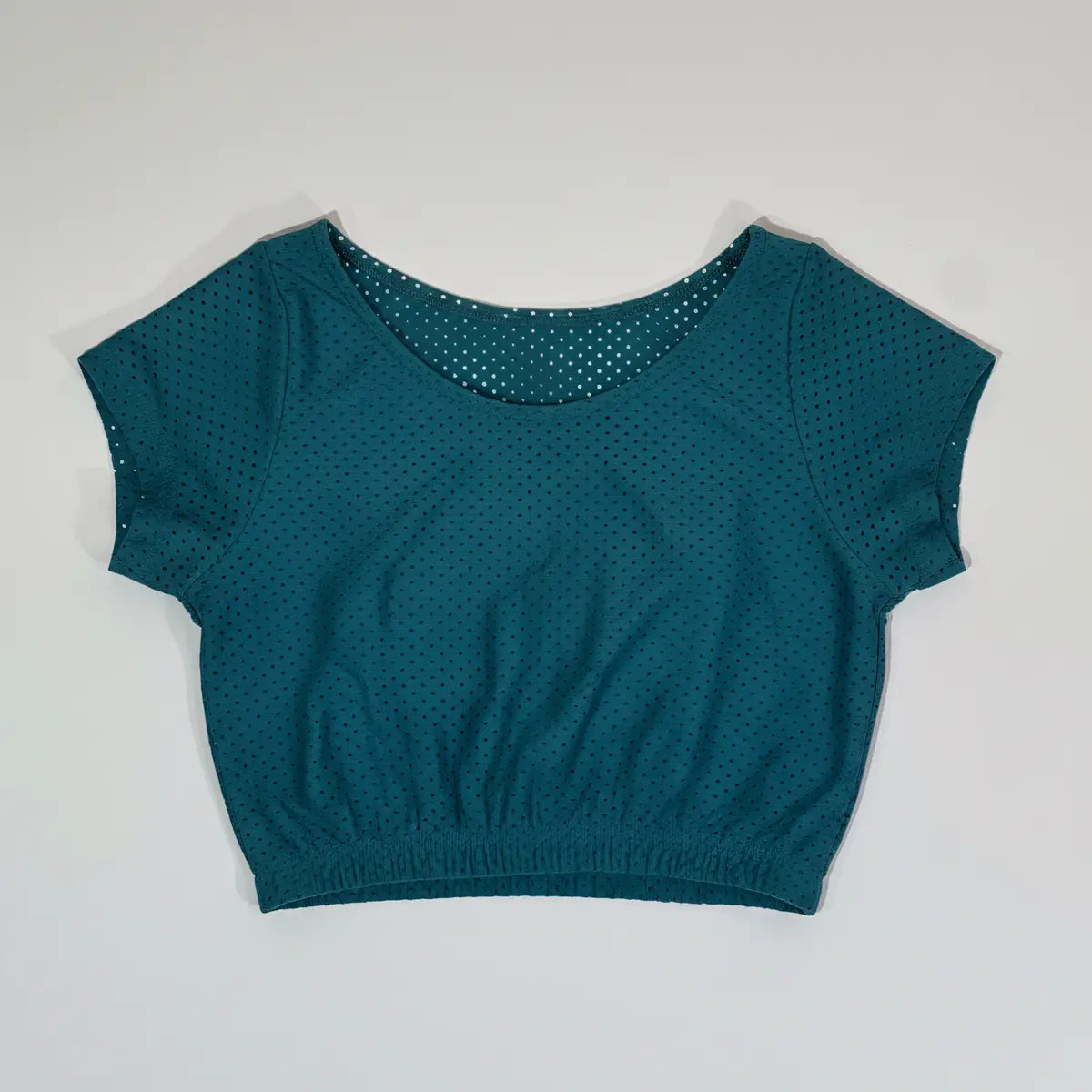 Crop top deportivo manga corta azul turquesa tejido microperforado con banda elástica mujer