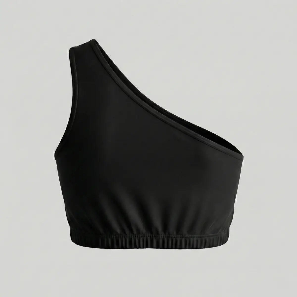 Top asimétrico negro liso vista trasera ropa deportiva sin costuras