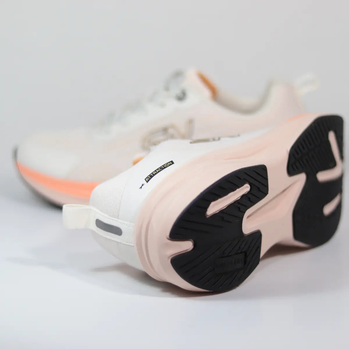 Suela exterior zapatillas deportivas mujer base negra con diseño entresuela crema y coral