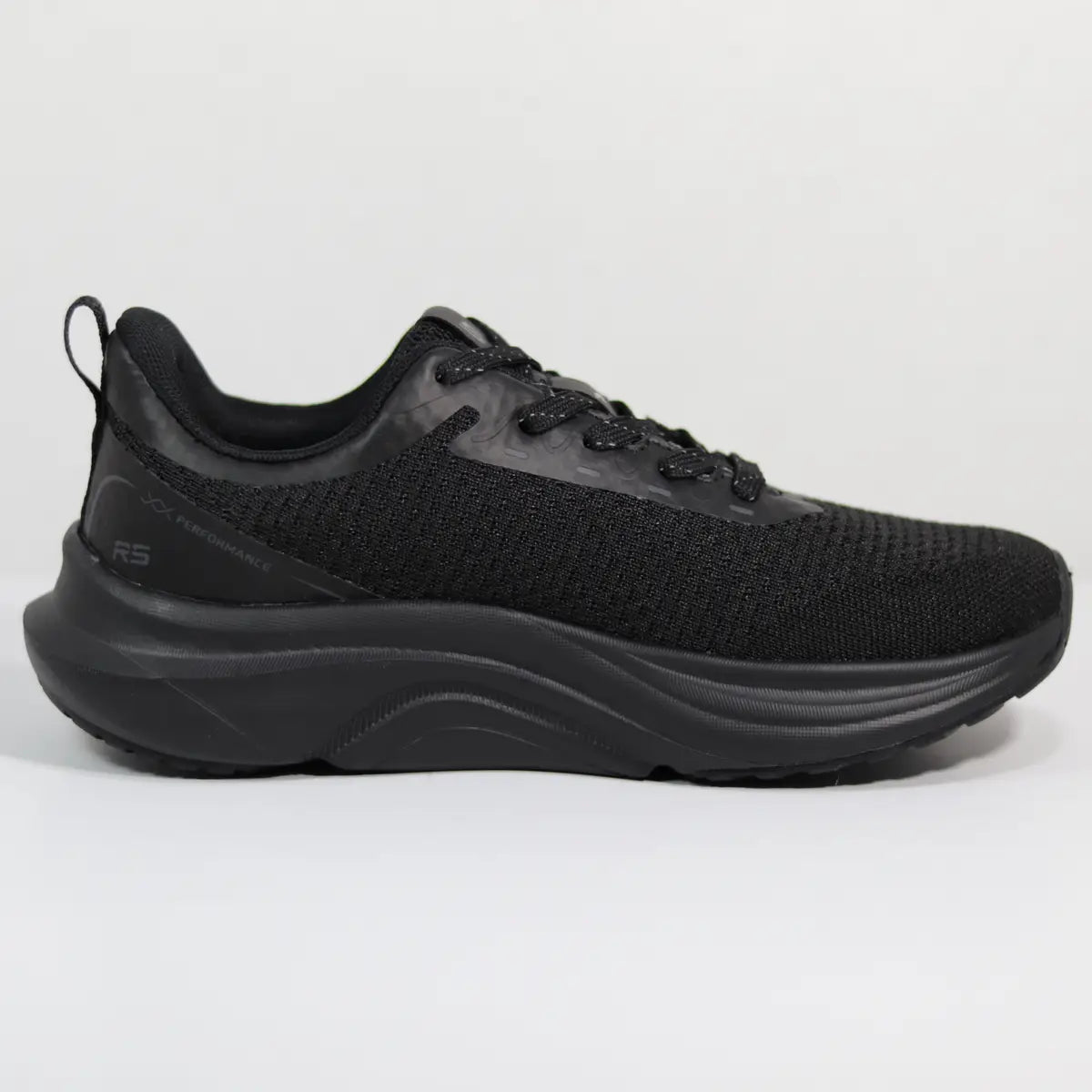Vista lateral interna zapatillas running negras mujer RS malla técnica transpirable