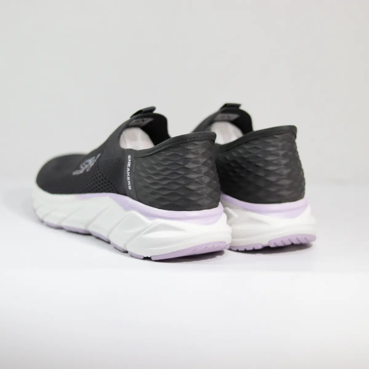 Vista trasera talón estructurado zapatillas mujer grises sin cordones suela lavanda