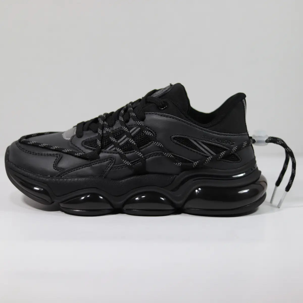Zapatillas hombre Sneakers Supply Phantom negras perfil lateral con suela de cápsulas brillantes