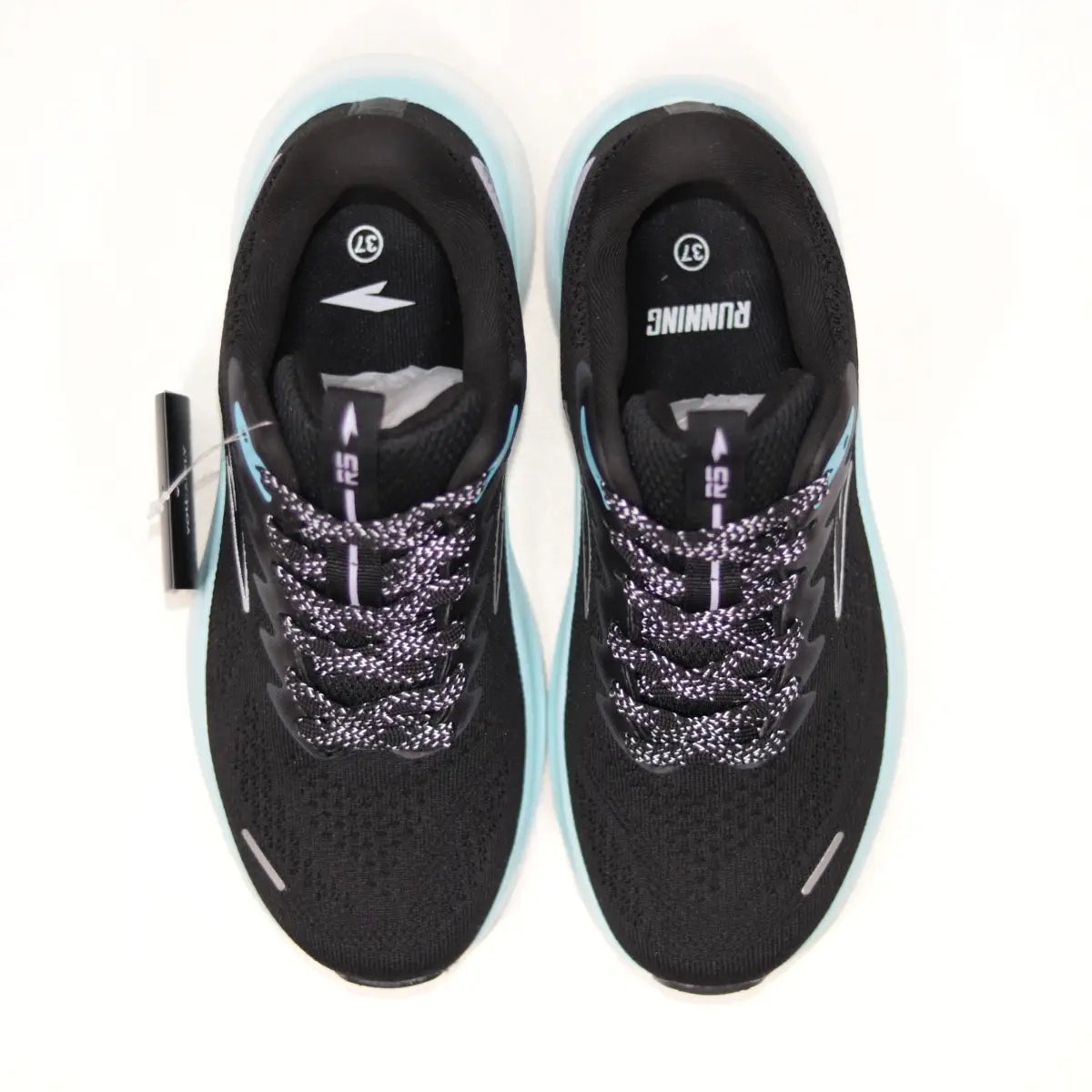 Vista superior interior zapatillas running mujer RS Protec negras mostrando plantillas y cordones.